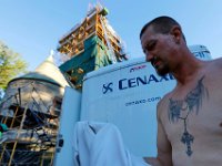 1010073504 ma nb GraceChurchSteeple  Jay Bishop, mason tender with Cenaxo, changes his shirt as he prepares to install the new steeple of the Grace Episcopal Church in New Bedford.   PETER PEREIRA/THE STANDARD-TIMES/SCMG : church, steeple